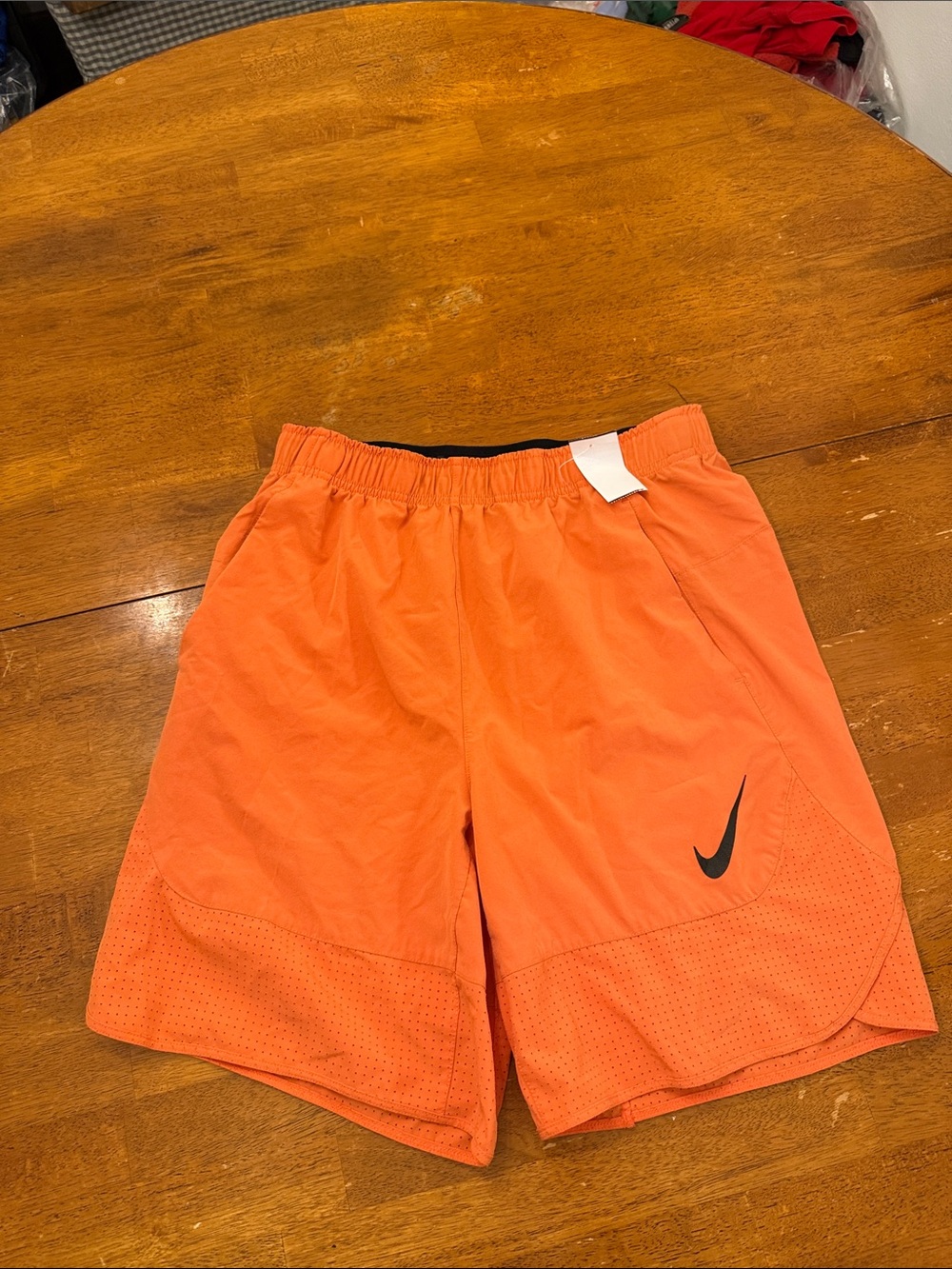 Nike Men’s Orange Athletic Training Shorts with Black Swoosh Medium